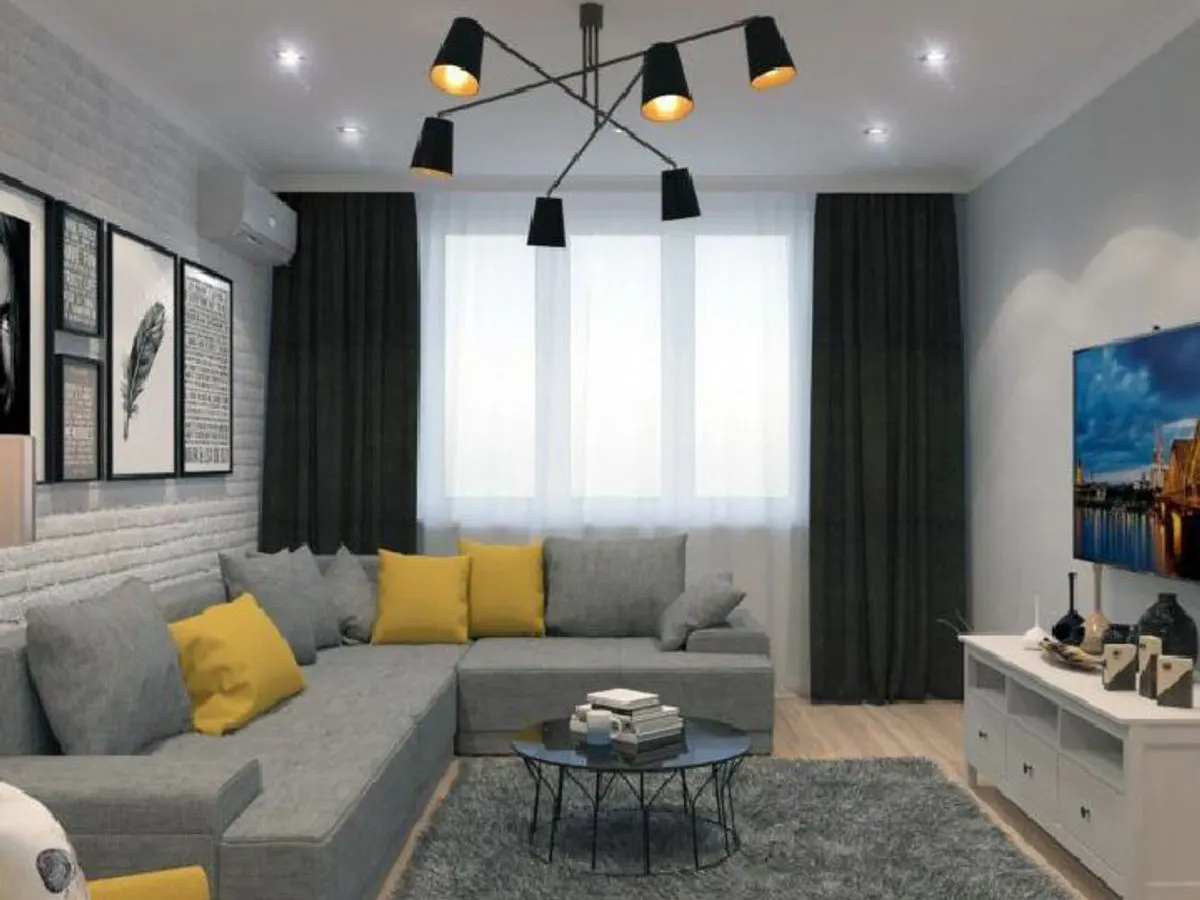 Contemporary living room with grey walls yellow accent cushions and modern ceiling light fixture